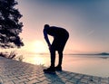 Male long distance runner in endurance training at mountain lake Royalty Free Stock Photo