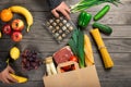 Male looks bag full of different healthy food