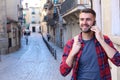 Male making a call while strolling around town Royalty Free Stock Photo