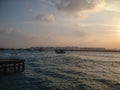 Male, Maldives - February 16, 2017: Terminal of Male airport MLE in the Maldives. View from the pier at sunset and boats