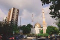 Cityscape View to the White and Golden Minaret and Dome of the largest Grand Friday Mosque in Maldives Royalty Free Stock Photo