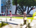 MALE, MALDIVES - NOVEMBER, 27, 2016: Little girl in a pink dress on roller skates. Copy space for text.