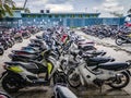 MALE, MALDIVES - NOVEMBER 7, 2019: Parking motorcycles in the port of Male Royalty Free Stock Photo