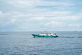 Speedboats on the choppy waters of the Indian Ocean transport passengers, divers, and hotel