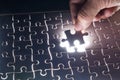 Male or Man Hand and Finger put Piece of Jigsaw in Place to Solve or Match Puzzle Royalty Free Stock Photo