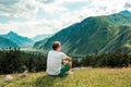 Male man traveler on the background of the Caucasian mountains Royalty Free Stock Photo