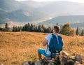 Male man traveler on the background of the Caucasian mountains Royalty Free Stock Photo