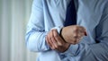 Male manager feeling wrist pain, joint inflammation, carpal tunnel syndrome Royalty Free Stock Photo
