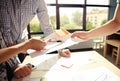 Male manager putting his ideas and writing business plan at workplace,man holding pens and papers, making notes in Royalty Free Stock Photo