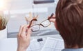 Close-up of a financial businessman holding an information sheet in his hands, reading the company& x27;s financial Royalty Free Stock Photo