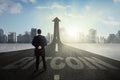 Male manager standing above bitcoin word Royalty Free Stock Photo