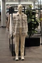 Male mannequin on display in store.