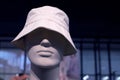 Male mannequin in a white panama hat on a showcase of a clothing store Royalty Free Stock Photo