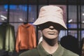Male mannequin in a white panama hat on a showcase of a clothing store Royalty Free Stock Photo