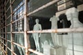 Male mannequins without clothes in a shop window. Naked plastic dummy in a closed store