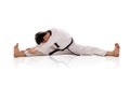 Male martial artist split and bend down isolated Royalty Free Stock Photo