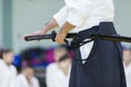 A male martial arts instructor with katana on seminar