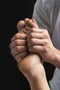 Male masseur hands doing reflexology massage on female foot reflex zones in the spa salon.