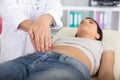 male masseur makes visceral massage internal organs