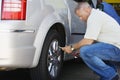 Male Mechanic Inflating RV Tire Royalty Free Stock Photo