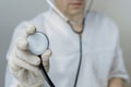 Male medicine doctor hand holding stethoscope. Medical help or insurance concept. Treatment and patient care concept. Royalty Free Stock Photo