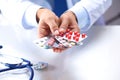 Male medicine doctor hands hold pills