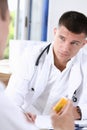 Male medicine doctor write prescription