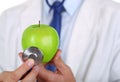 Male medicine therapeutist doctor hands holding green fresh ripe Royalty Free Stock Photo