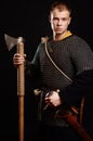 Male medieval warrior in armour and chain mail, viking with batt