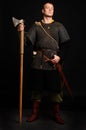Male medieval warrior in armour and chain mail, viking with batt
