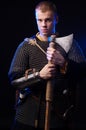 Male medieval warrior in armour and chain mail, viking with batt