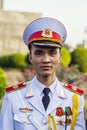 Male member of the Vietnamese army wearing his uniform and posing for the camera.