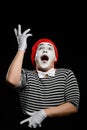 Male mime on black. Man, as a pantomime actor