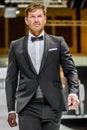 Male model on catwalk wearing bridegroom suit