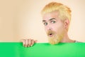 Male model holding white board. Funny Man showing a blank white board. Blank, empty paper, billboard with copy space for Royalty Free Stock Photo