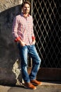 Male model leaning against wall Royalty Free Stock Photo