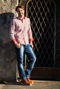 Male model leaning against wall Royalty Free Stock Photo