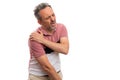 Male model touching painful shoulder as hurt gesture concept Royalty Free Stock Photo