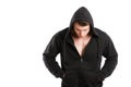 Male model wearing just black hoodie and looking down Royalty Free Stock Photo