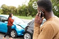 Male Motorist Involved In Car Accident Calling Insurance Company Or Recovery Service