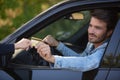 male motorist passing bank card through window Royalty Free Stock Photo