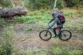 Male mountain biker riding bicycle in the forest Royalty Free Stock Photo