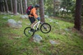 Male mountain biker riding bicycle in the forest Royalty Free Stock Photo