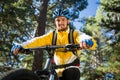 Male mountain biker riding bicycle in the forest Royalty Free Stock Photo