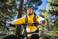 Male mountain biker riding bicycle in the forest Royalty Free Stock Photo