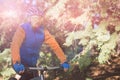 Male mountain biker riding bicycle in forest Royalty Free Stock Photo