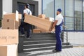 Male movers carrying shelving unit Royalty Free Stock Photo