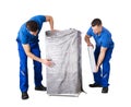 Male Movers Wrapping The Home Appliances With Plastic Wrap Royalty Free Stock Photo