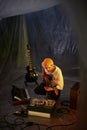 Male Musician with Guitar in Makeshift Studio