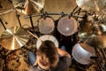 Male musician playing drums and cymbals at concert